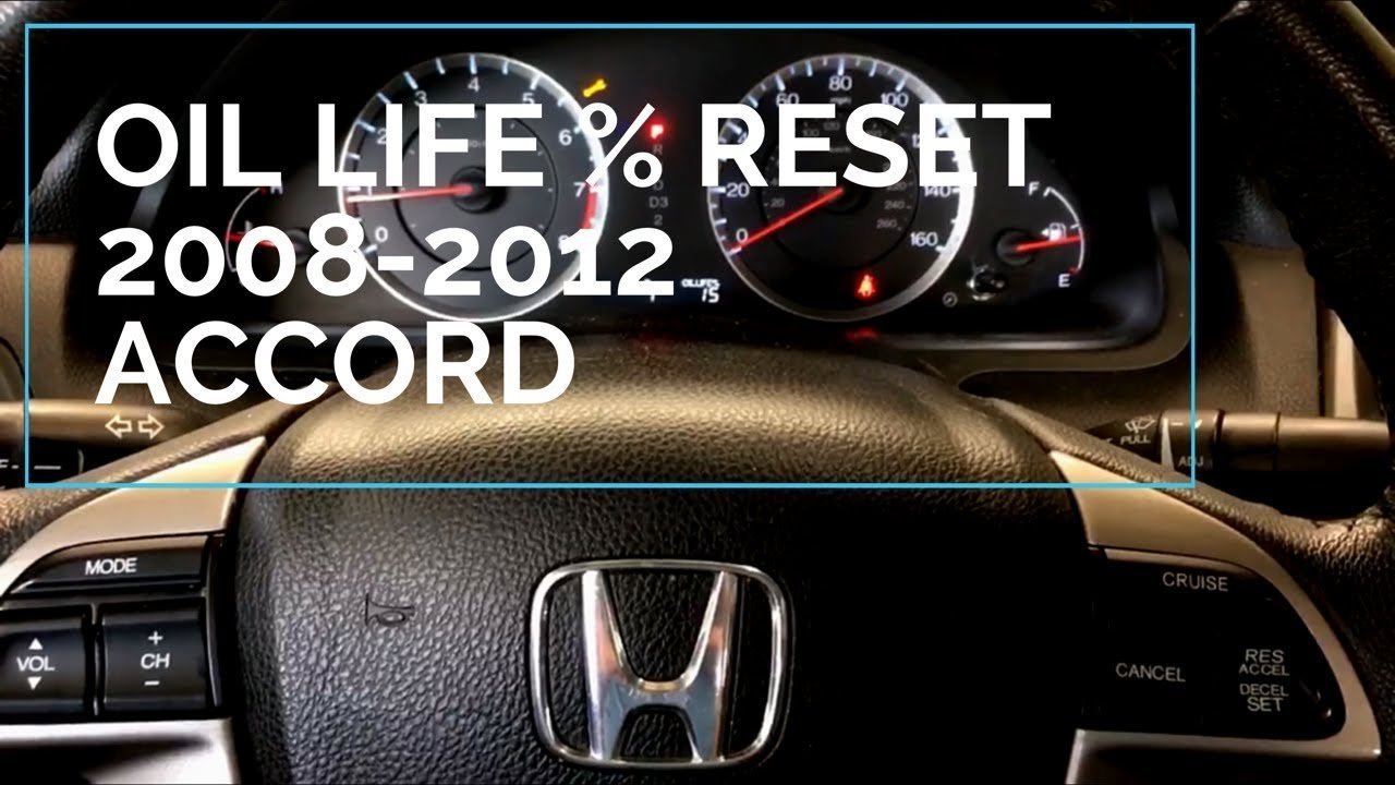 A hand pressing the reset knob on a 2008 Honda Accord dashboard.