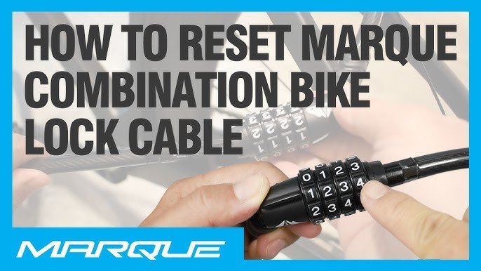 A close-up of a bicycle combination lock set against a blurred urban background.