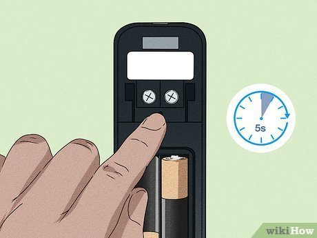 A person timing the quick process of resetting a smart doorbell.