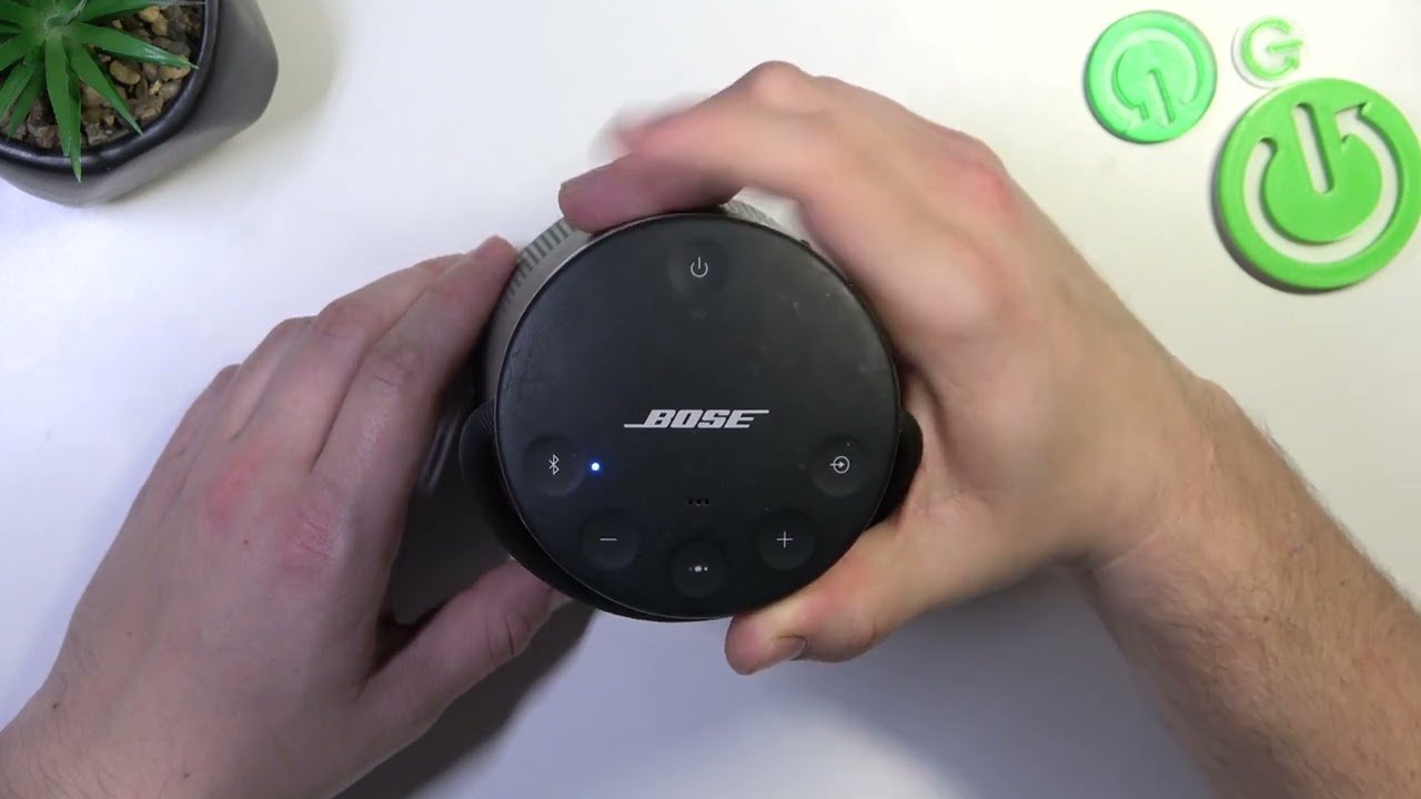 Essential charging cables and power adapters placed next to a Bose SoundLink speaker.