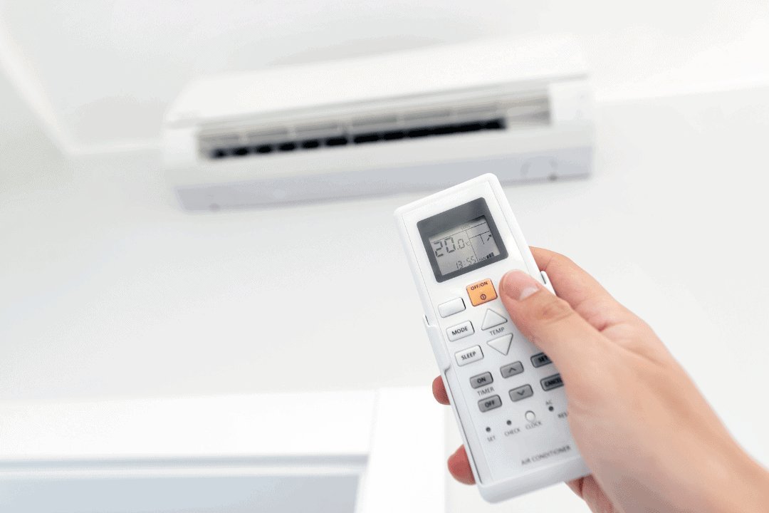 Using an infrared thermometer to verify a successful air conditioner unit reset.