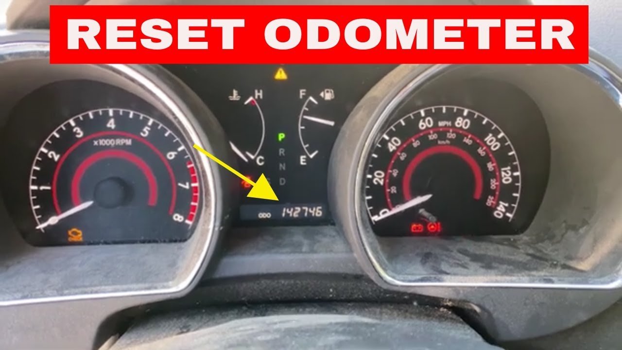 A modern car dashboard featuring a digital display for resetting vehicle mileage.