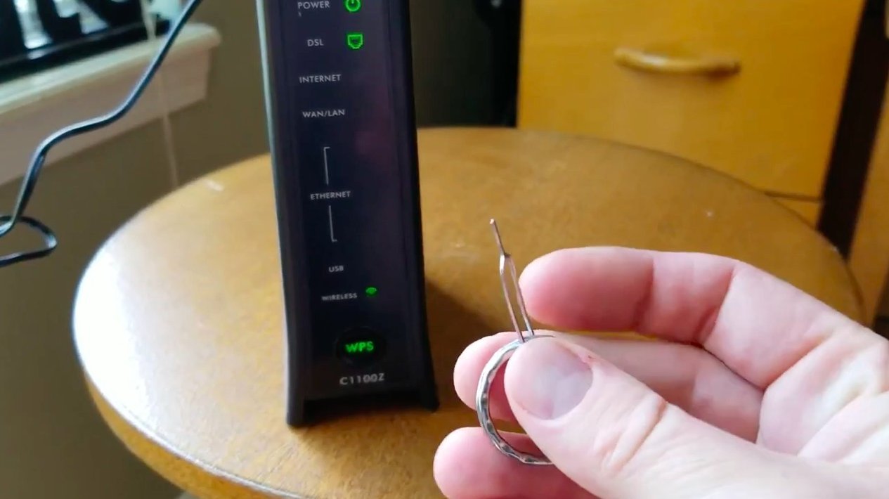 The solid green status light on a router indicates a successful system reset.
