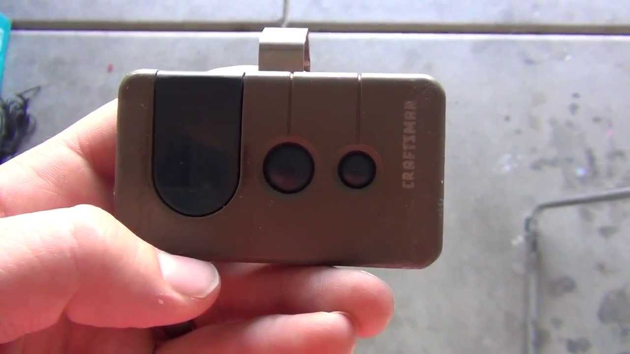 Adjusting the travel limit screws on a craftsman garage door opener motor.