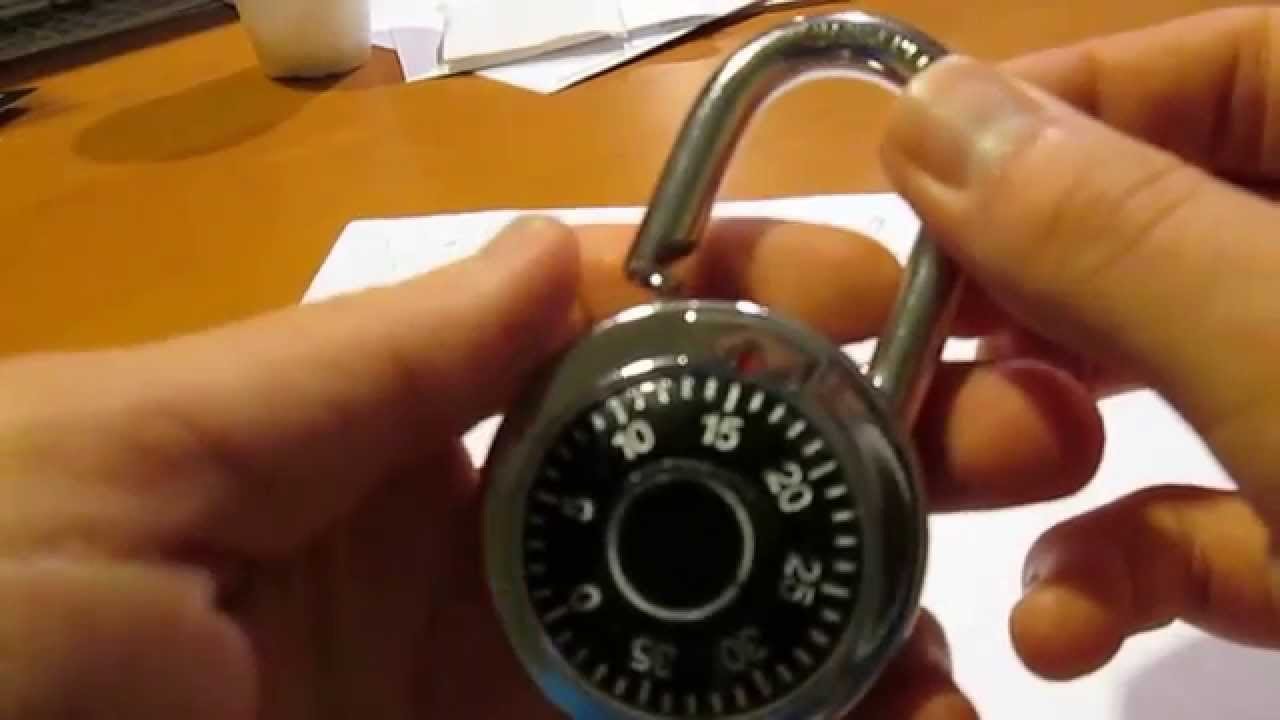 Essential tools for resetting a dial lock arranged neatly on a desk.
