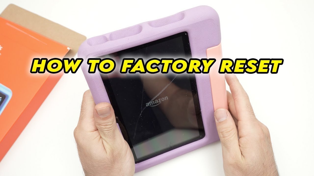The tablet displays a language selection screen indicating the factory reset is complete.