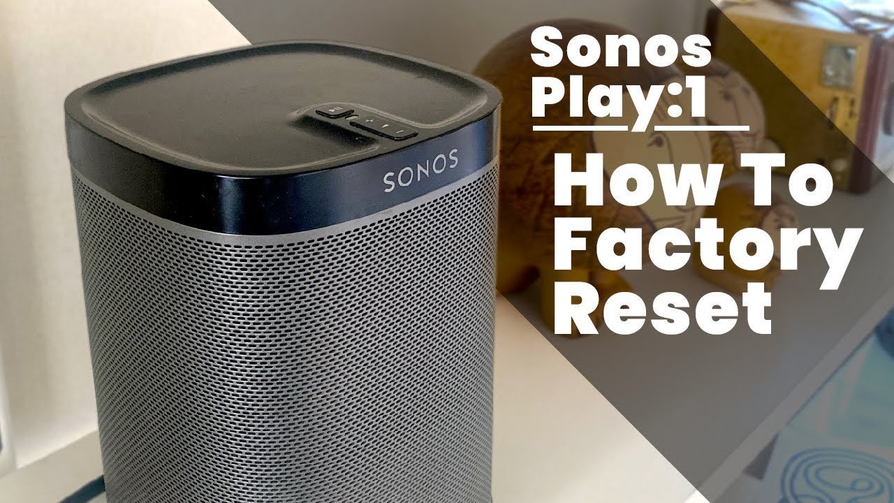 A hand pressing the play button on a Sonos Play 1 while plugging it in.