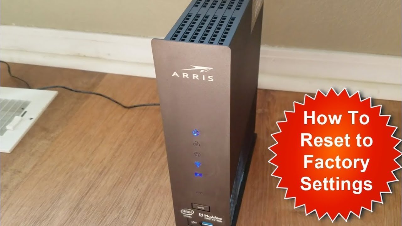 An Arris router with steady glowing status lights indicating a successful reset.
