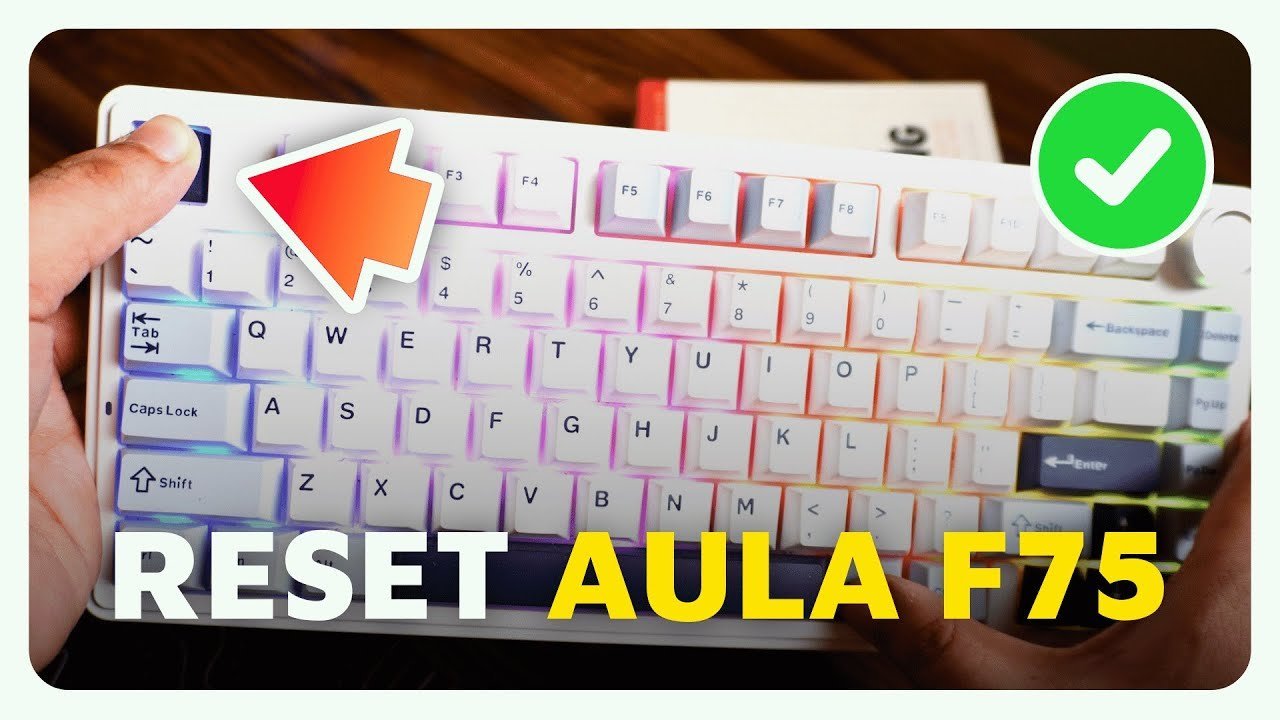 A modern Aula mechanical keyboard sits on a clean desk ready for troubleshooting.
