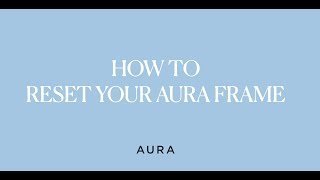 Essential tools like a smartphone and paperclip needed to reset an Aura frame.
