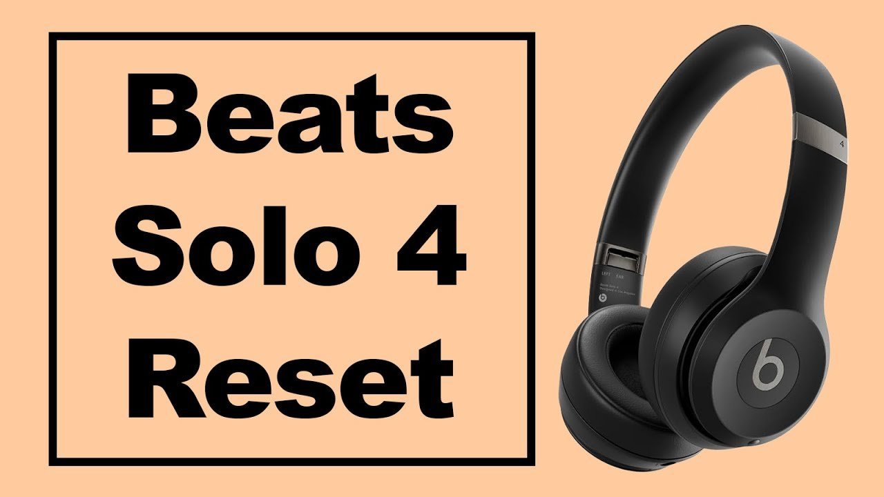 Headphones disconnected from a charging cable to perform a proper factory reset.