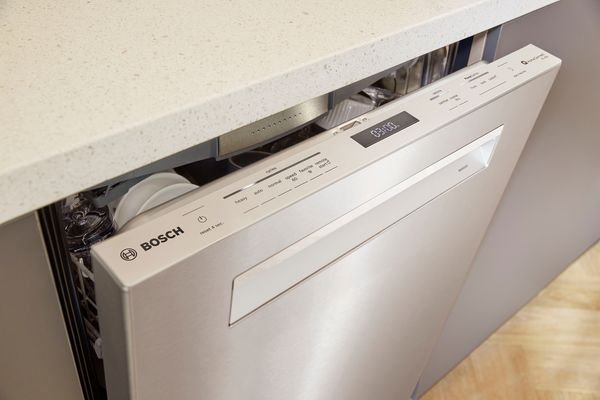 A modern Bosch dishwasher in a bright kitchen waiting for a system reset.