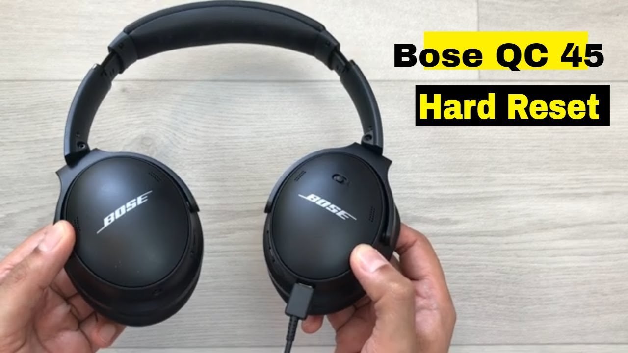 Smartphone displaying technical support information next to a pair of wireless headphones.
