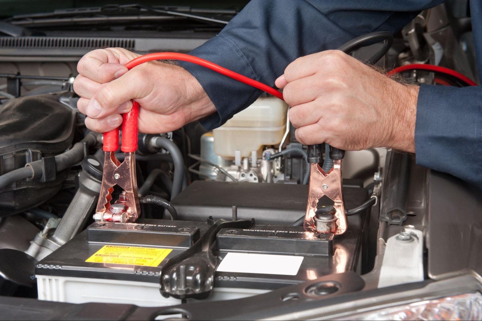 Essential tools and safety gear needed for a car computer reset on a workbench.