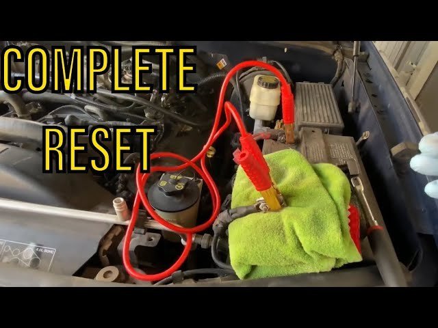 Removing a fuse from a vehicle panel as an alternative car computer reset method.