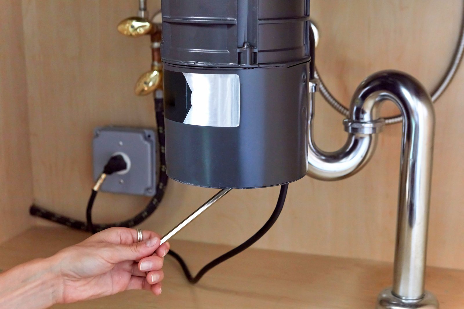 Removing debris from the sink drain as an alternative way to fix disposal issues.
