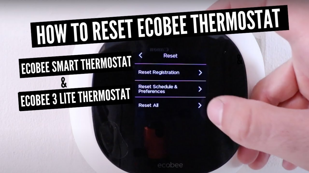 A hand using the touchscreen menu to reset a smart thermostat.