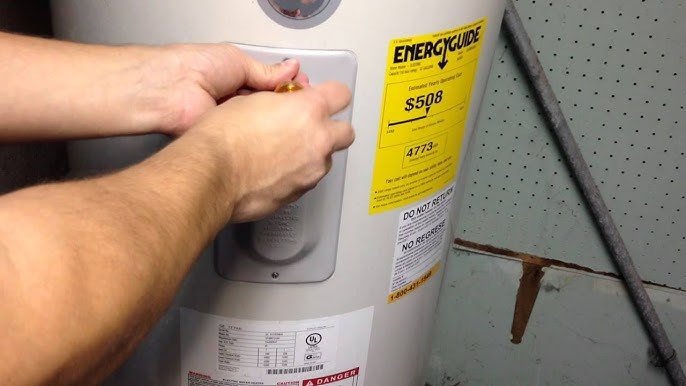 A hand flipping a circuit breaker switch to restore power to the heater.