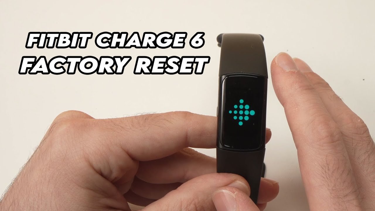 A Fitbit Charge 6 displays a white logo on its screen during reboot.