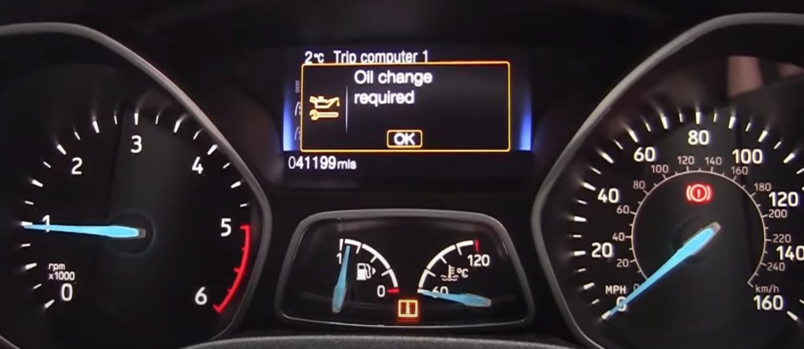 Essential tools and car keys needed for a Ford Focus oil change reset.
