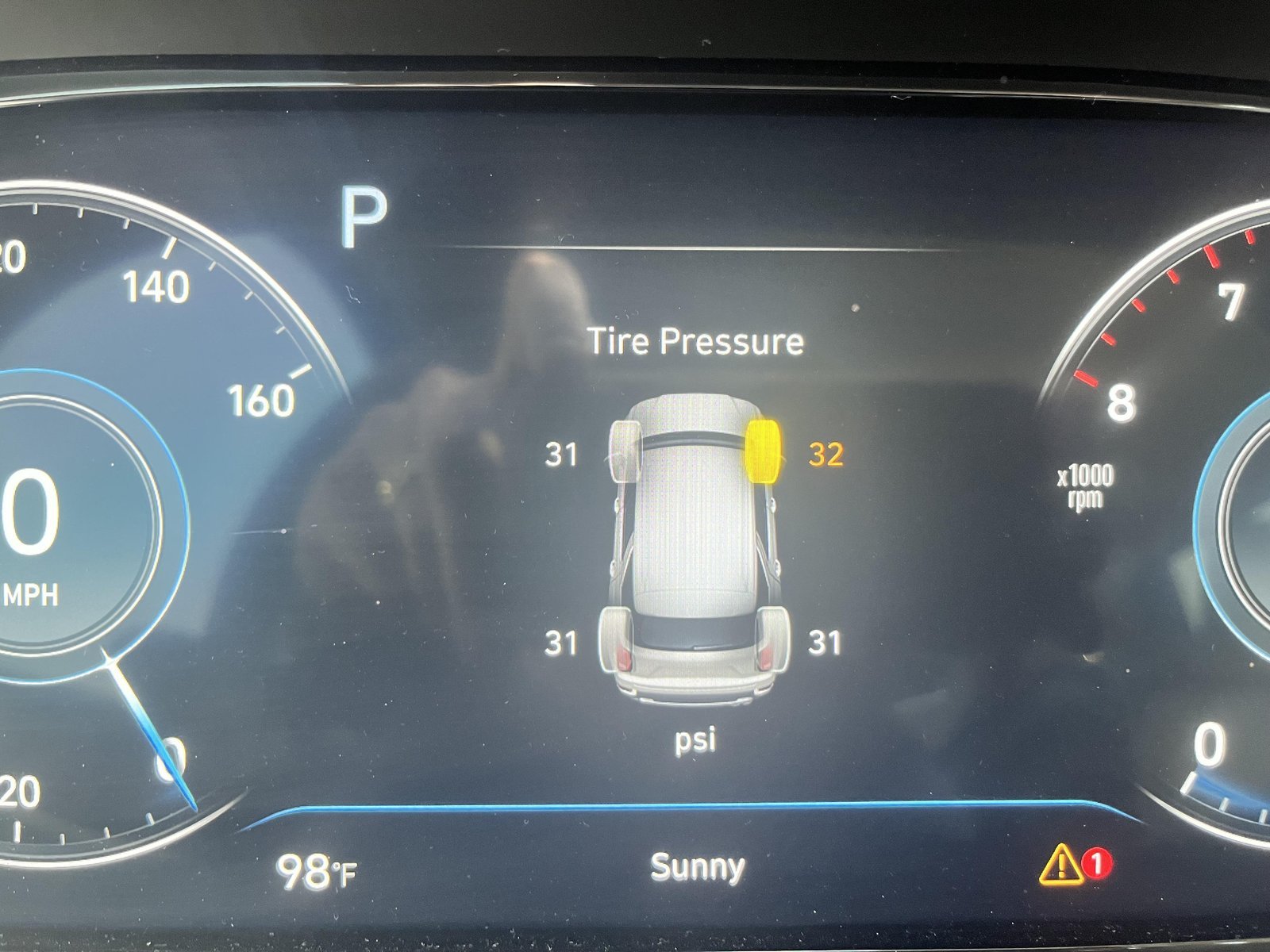 Essential tools like a digital pressure gauge and tire inflator for TPMS maintenance.
