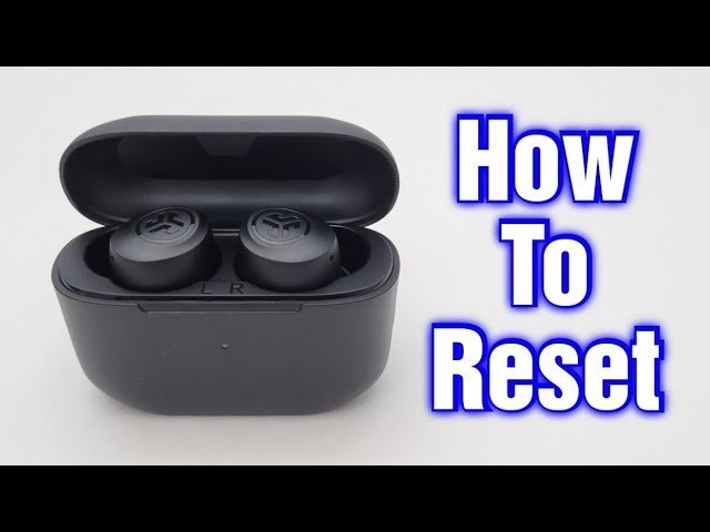 Fingers tapping the sensor on a wireless earbud inside a charging case.