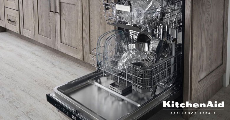 A modern KitchenAid dishwasher installed in a clean, bright, and contemporary kitchen space.