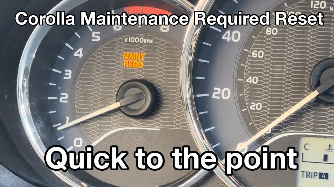 A hand cautiously resting on the reset button near the odometer screen.