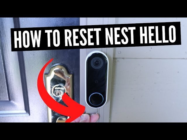 A smartphone app interface next to a smart doorbell device on a desk.