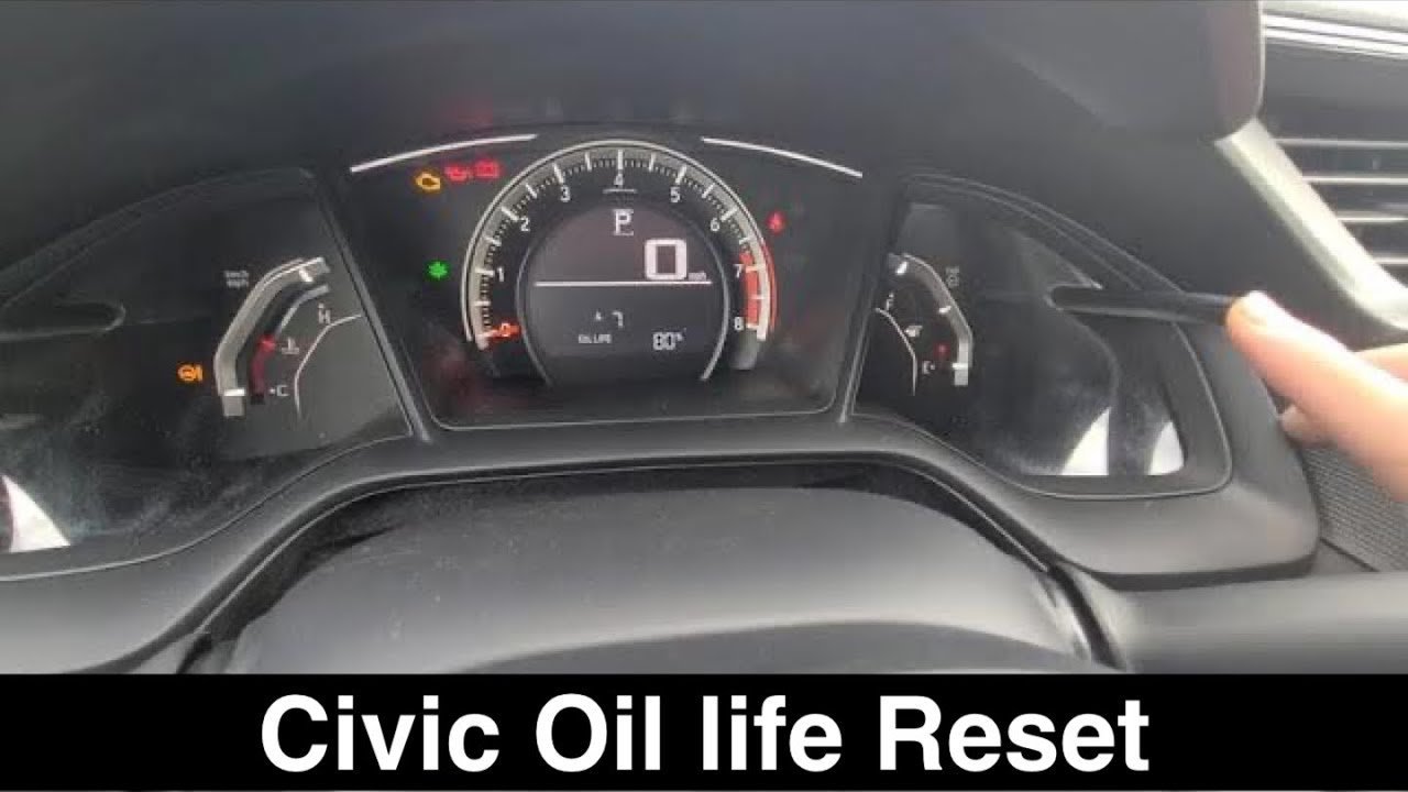 Dashboard controls used for navigating Honda Civic maintenance intervals and service menus.