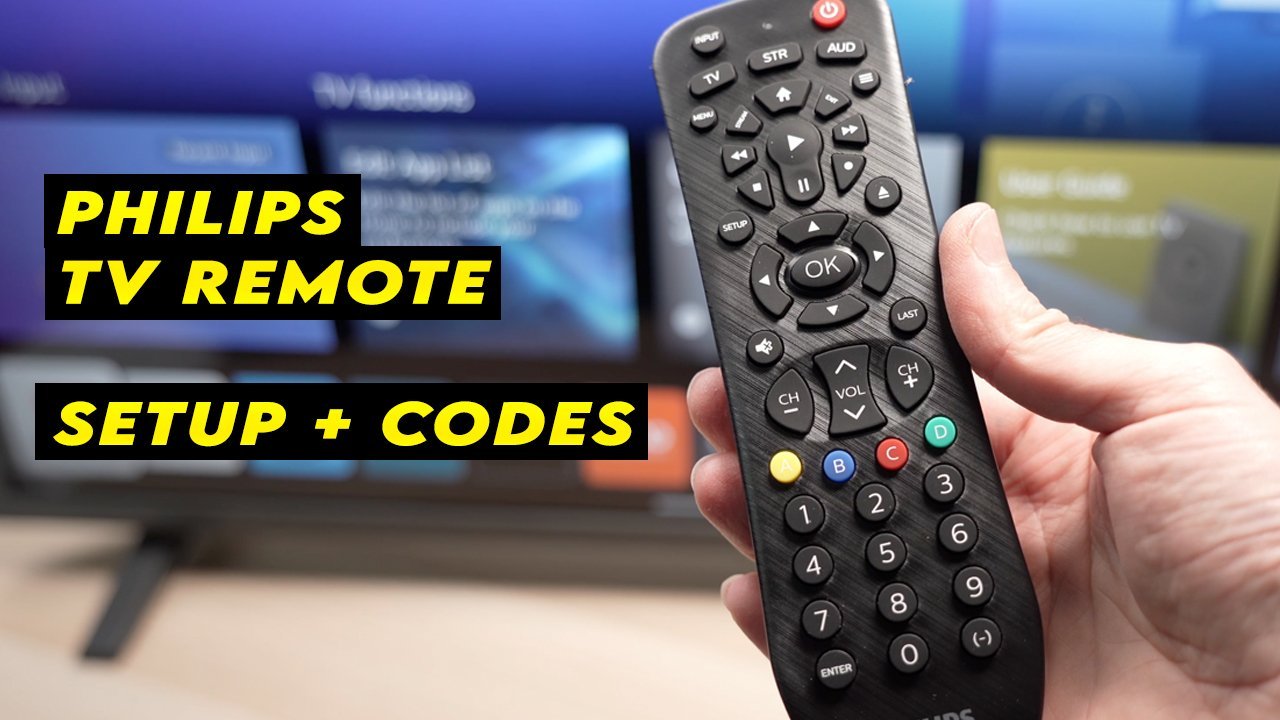 A person points a remote toward a television to begin the reset process.