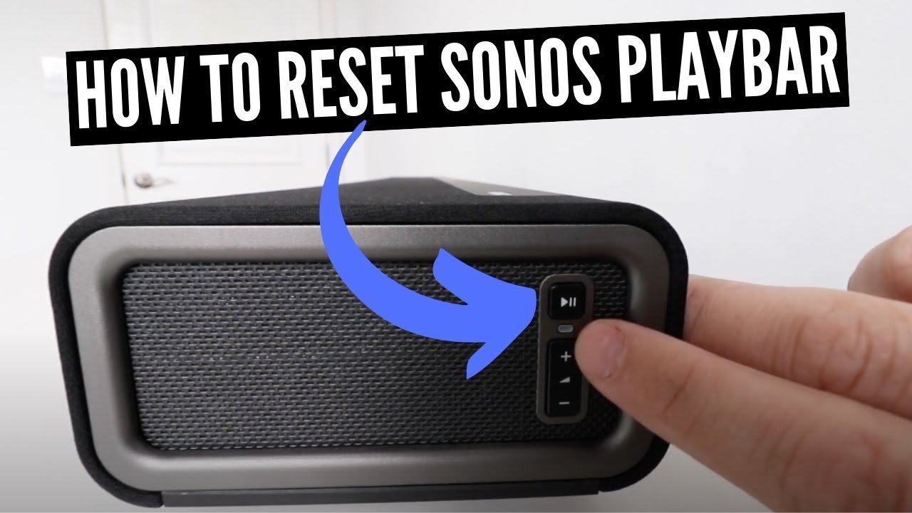A modern black Sonos Playbar resting on a minimalist white living room console.
