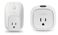 The small physical reset button located on a Wemo smart plug.