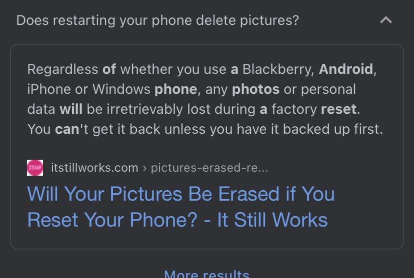 Hands holding a smartphone while viewing the settings menu for a reset.
